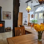 Wohnraum mit Kaminofen Ansicht – Mühlenhof